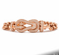 Rose gold knot bracelet stock image
