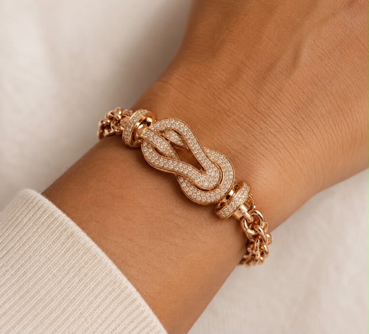 Rose gold knot bracelet worn on wrist