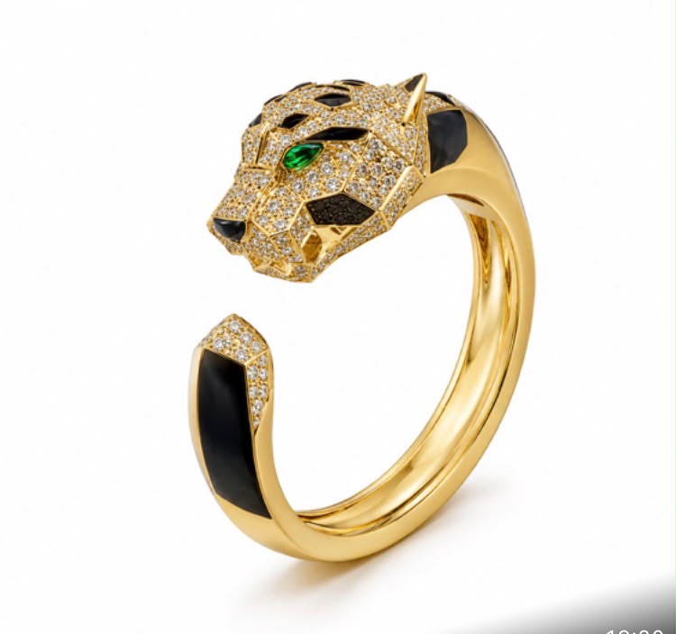 Diamond Pavé Panther Bangle product shot showing panther head and emerald eyes