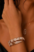 Diamond Pavé Serpent Wrap Bracelet worn on wrist with floating diamond necklace